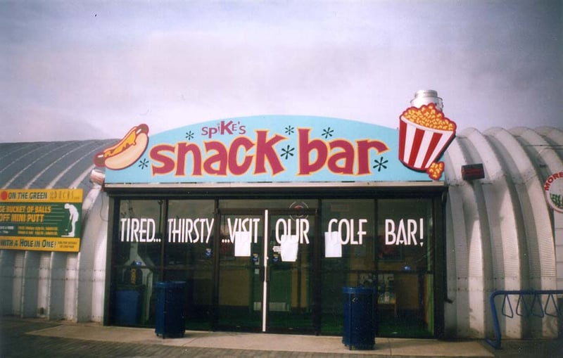 The Docks snack bar "Spike's Snack Bar" has a golf bar in the back for the day-time golfers.