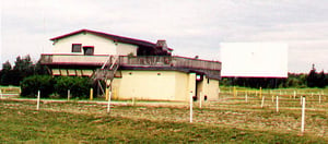 projection / concessions building, screen tower, and field; before improvements