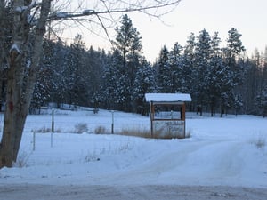 Box office and field.  Huge concrete piers that held screen visible in distance.