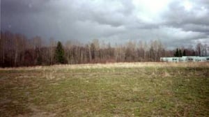 Back part of the field. The fence line goes right up to the buildings, almost.