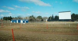 projection booth, lot, screen tower, and speakerless poles(they use FM sound today)
