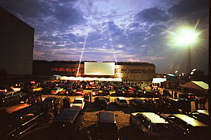 night photo of screen and lot; taken in 1999
