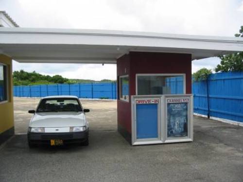 Ticket booth. In back of the theatre.