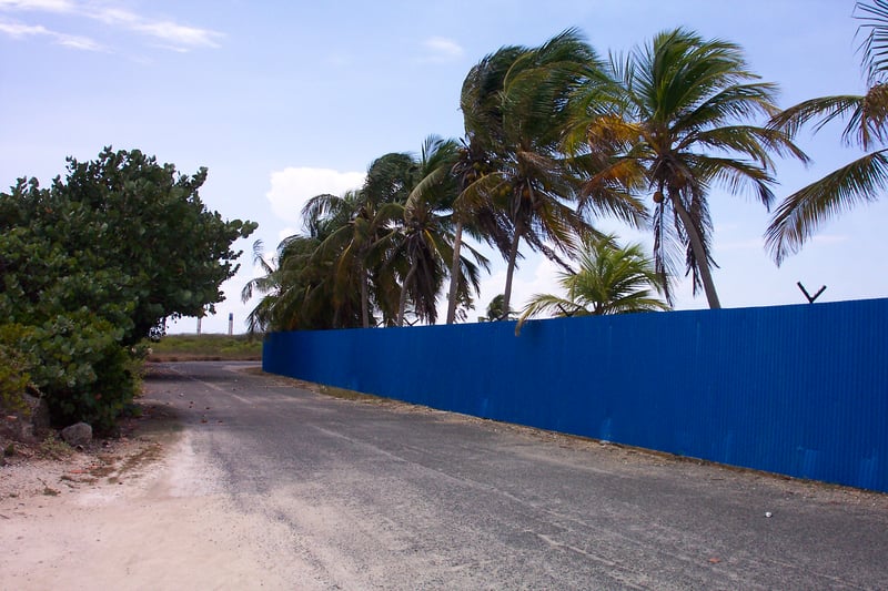 Entrance road with fence.