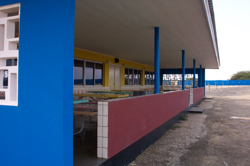 screen side view of covered seating area of snack bar.