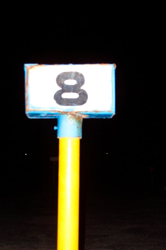 Unlit row marker at night.