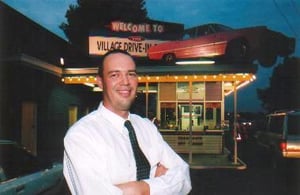 Buddy stands at the Coburg ticket box as hundreds of cars enter for a night under the stars. Anna Joske Photo 2001.