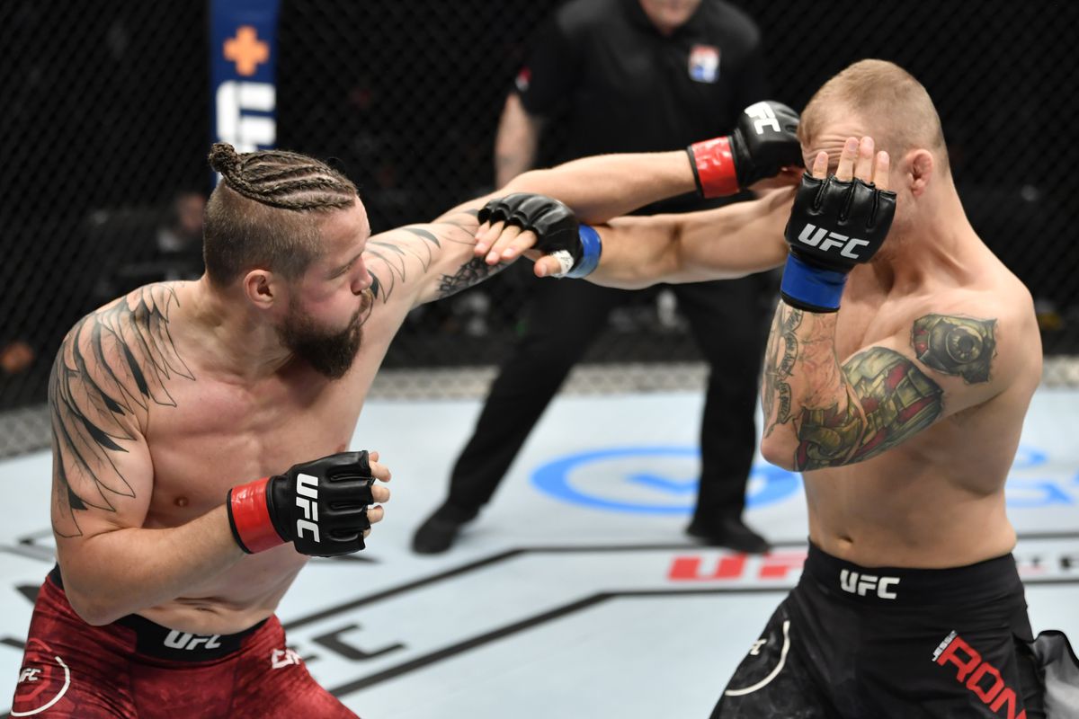Nicolas Dalby fires a left hook at Jesse Ronson. Credit: DraftKings Network.