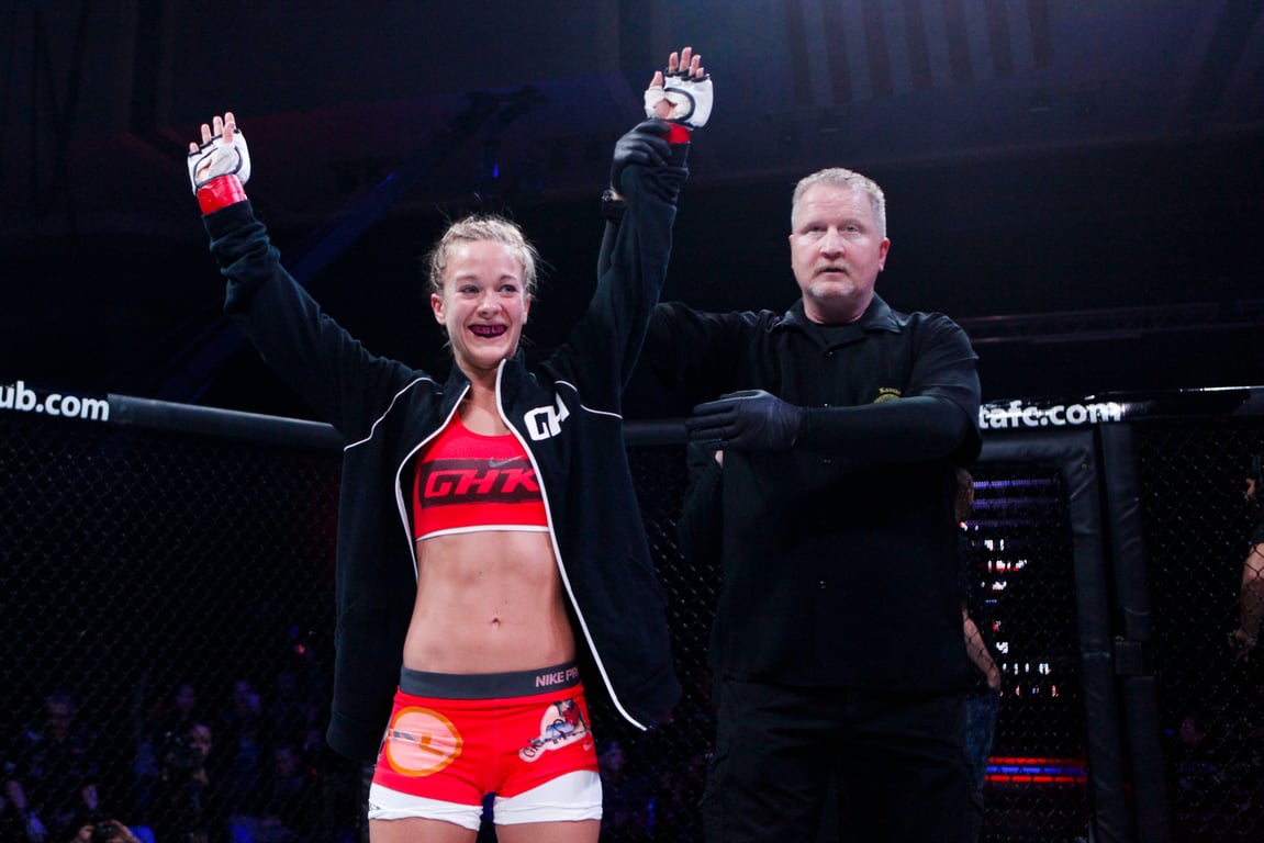 Laura Sanko with her hand raised. Captured by Esther Lin