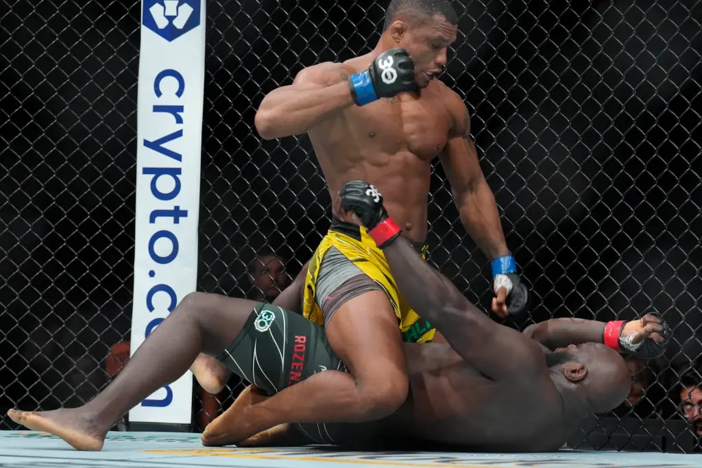 Jailton Almeida dominating Jairzinho Rozenstruik on the ground in his first UFC main event. Credits to: Jim Dedmon - USA TODAY Sports.
