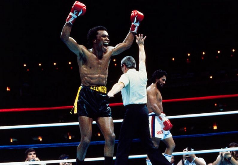 Sugar Ray Leonard celebrating after Roberto Duran says No Mas to the referee. Credits to: AP Photo