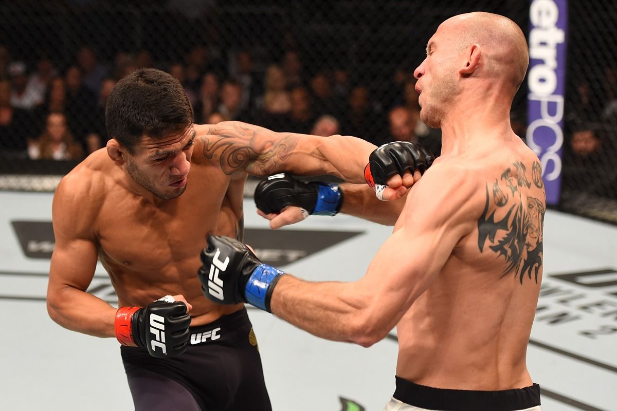 Rafael Dos Anjos cracks Donald Cerrone with a right hand. Credit: Bleacher Report.