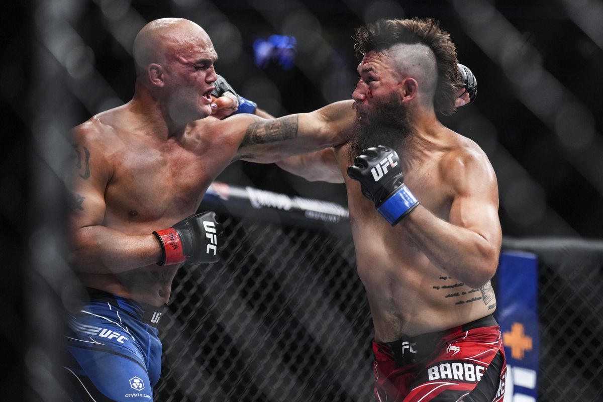 Bryan Barberena exchanges punches with Robbie Lawler. Credit: MMA Fighting.