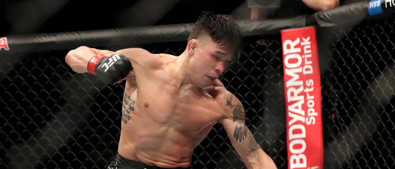 Ricky Simon finishing Jack Shore in his last win. Credits to: AP Photo - Gregory Payan.