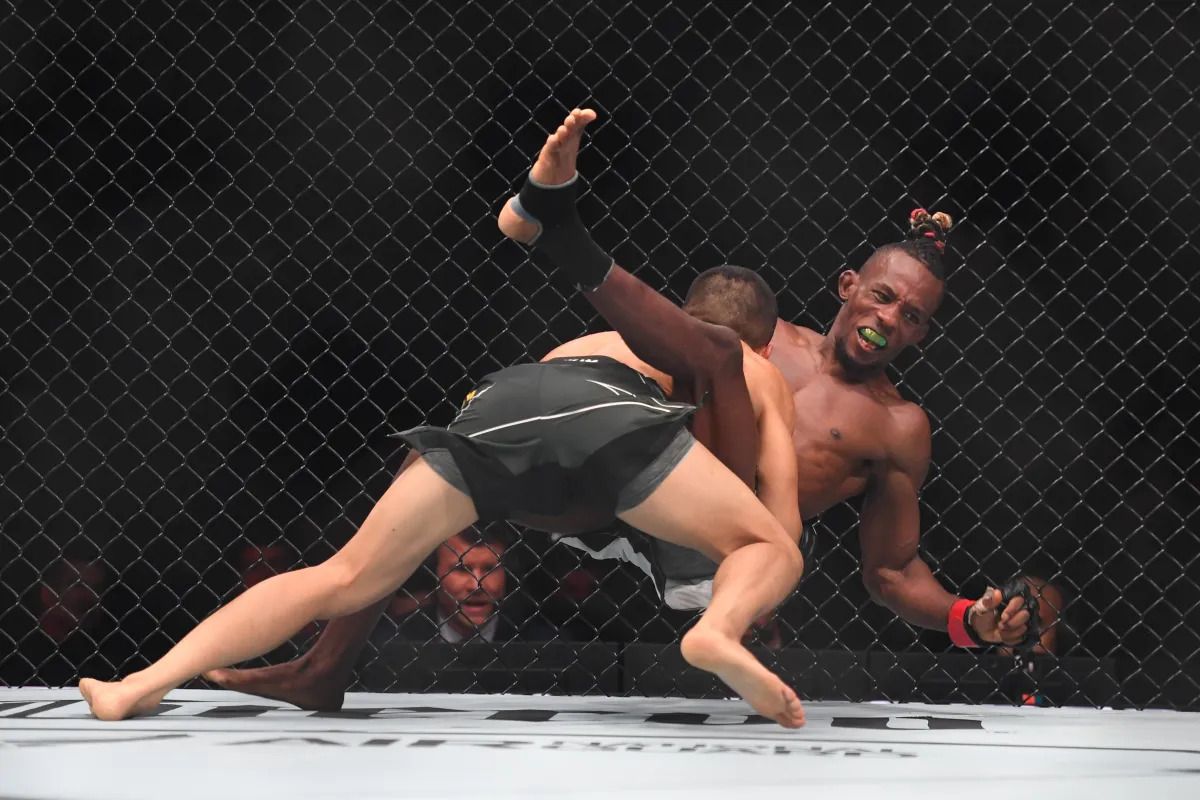 Asu Almabayev lands a commanding takedown on Ode' Osbourne. Credit: Zuffa LLC.
