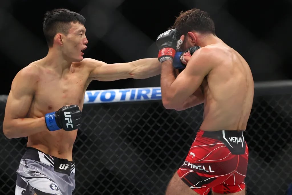  Sumudaerji landing an exceptional straight on Matt Schnell. Credits to: Ed Mulholland, USA TODAY Sports