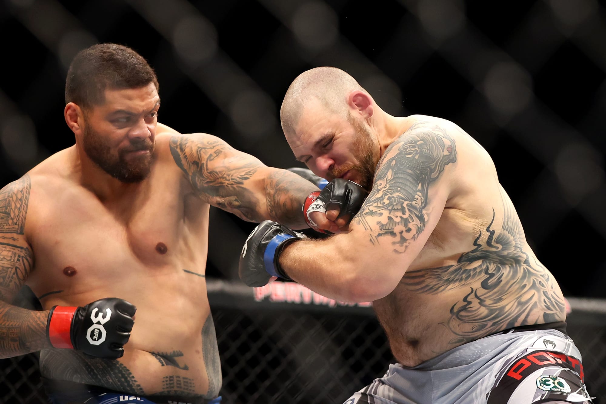 Justin Tafa lands a left hand on Parker Porter. Credit: FanSided.