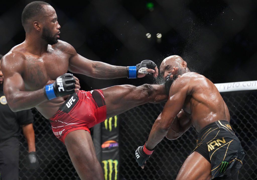Leon Edwards headkicks Kamaru Usman. Credits to: Chris Unger of Zuffa LLC.
