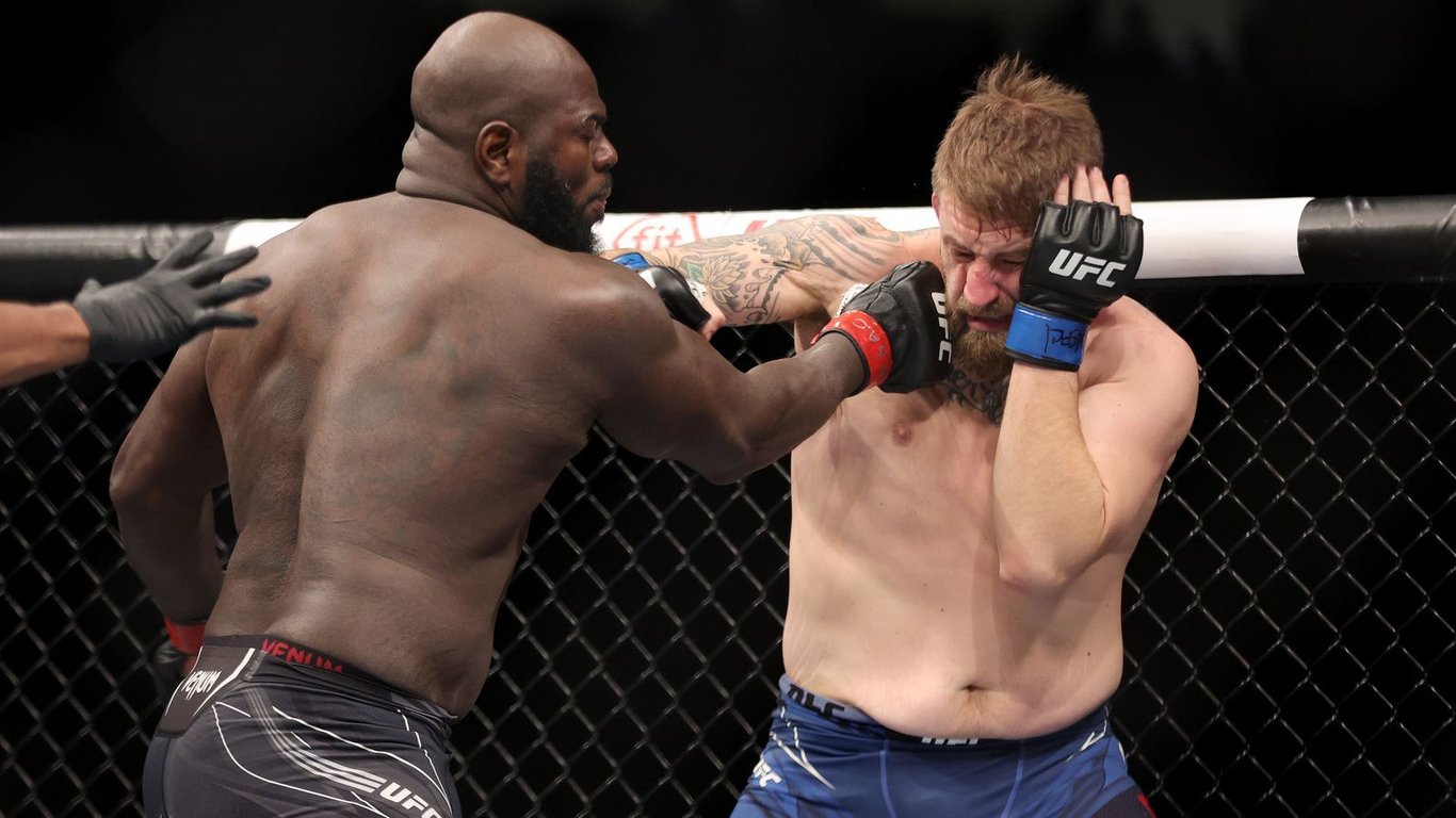 Jairzinho Rozenstruik landing a devastating shot on Chris Daukaus at UFC 282. Credits to: Dan Hiergesell - MMA Mania.