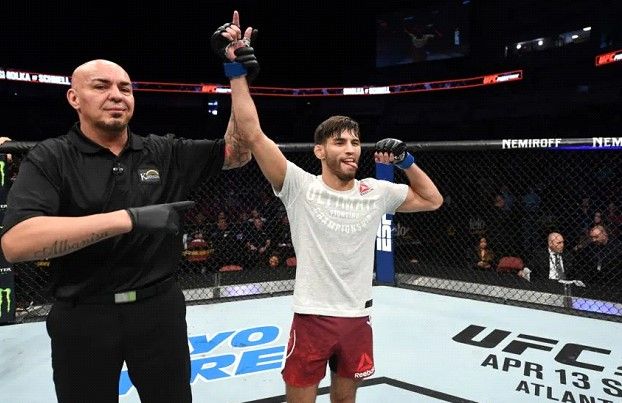 Matt Schnell gets his hand raised. Credits to: Josh Hedges/Zuffa LLC.
