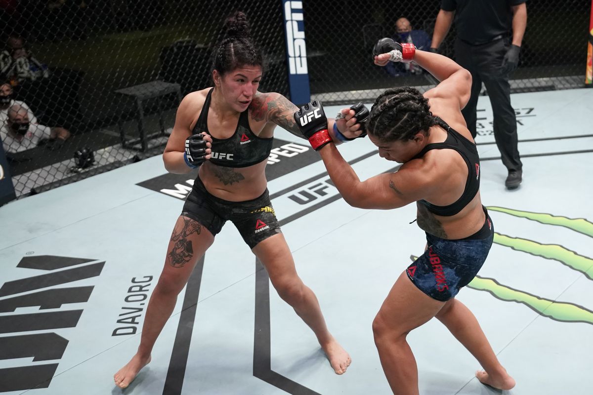 Pannie Kianzad rocks Sijara Eubanks with a left straight. Credit: MMA Fighting.