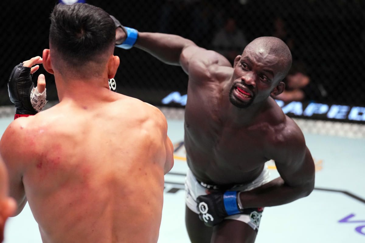 Themba Gorimbo fires a right hand at Ramiz Brahimaj. Credit: MMA Fighting.