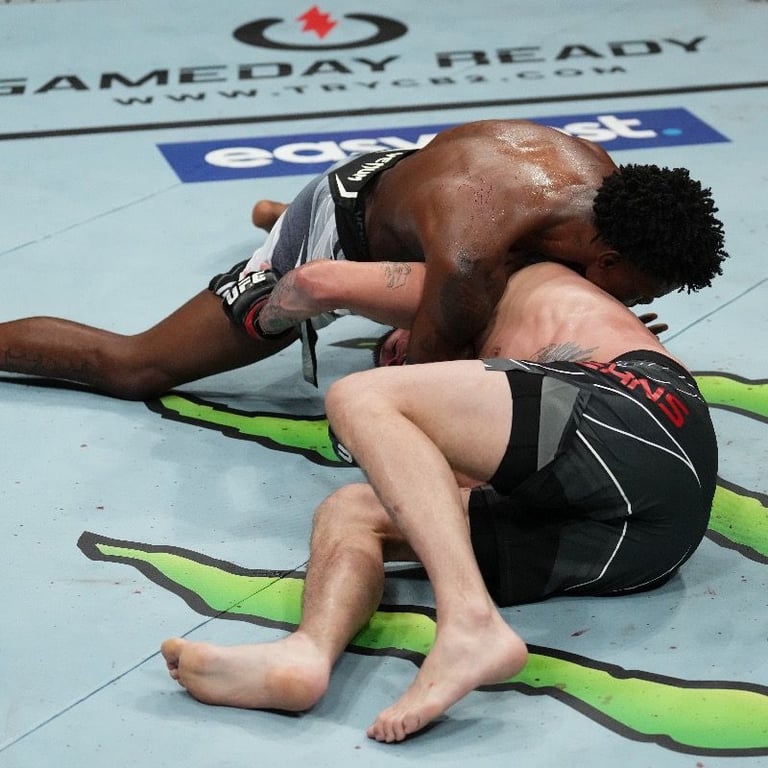 Kevin Holland locks up D'Arce Choke. Credits to: firstsportz.com. 