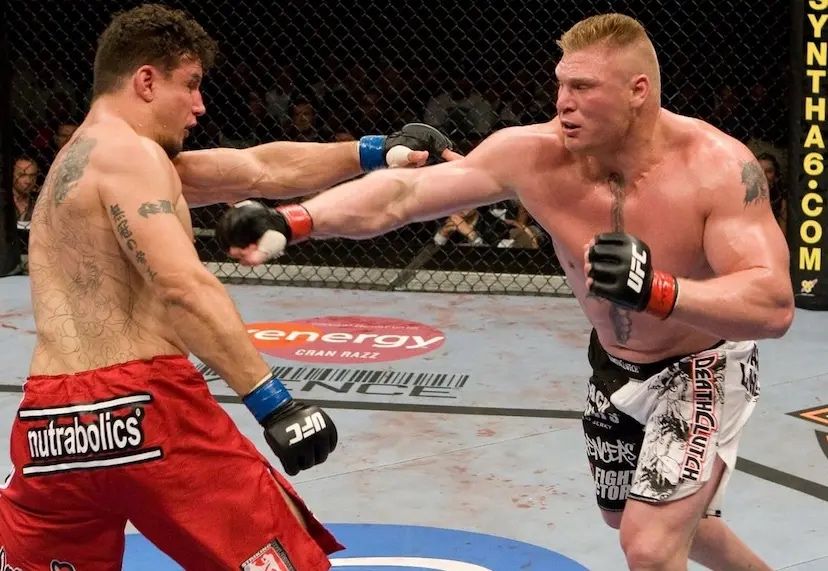 Brock Lesnar and Frank Mir exchanging at UFC 100. Credits to: Thomas Gerbasi - Zuffa LLC.