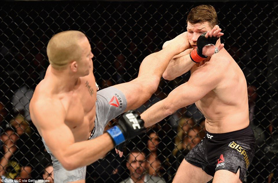 Georges St-Pierre fires a head kick on Michael Bisping. Cedit: Zuffa LLC - Getty Images.