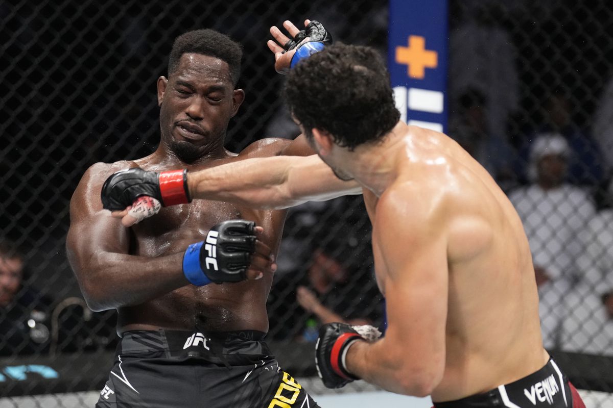 Armen Petrosyan blasts AJ Dobson with a right hand. Credit: MMA Mania.