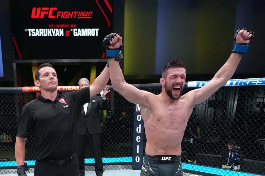 Mateusz Gamrot getting his hand raised after his main event decision victory vs. Arman Tsaurkyan. Credits to: Jeff Botari - Zuffa LLC.