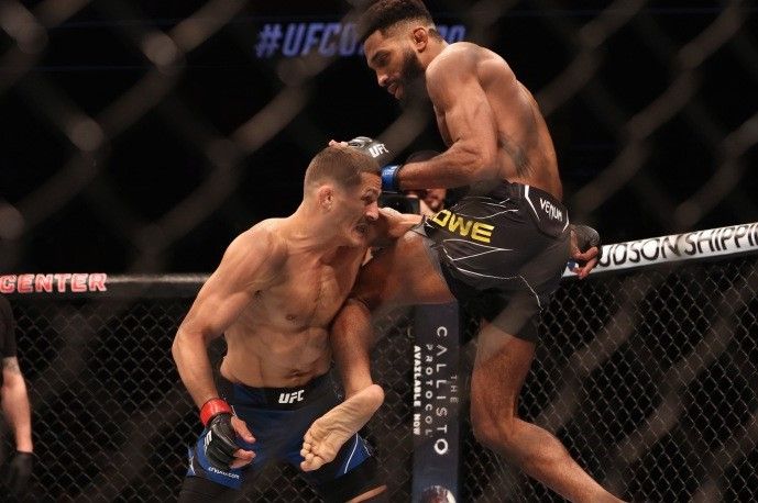 Philip Rowe throwing a flying knee in his last bout vs. Niko Price. Credits to: Nathan Ray Seebeck - USA TODAY Sports.