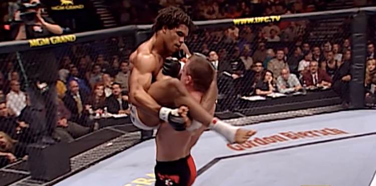 Matt Hughes carries Carlos Newton across the octagon. Credits to: Zuffa LLC