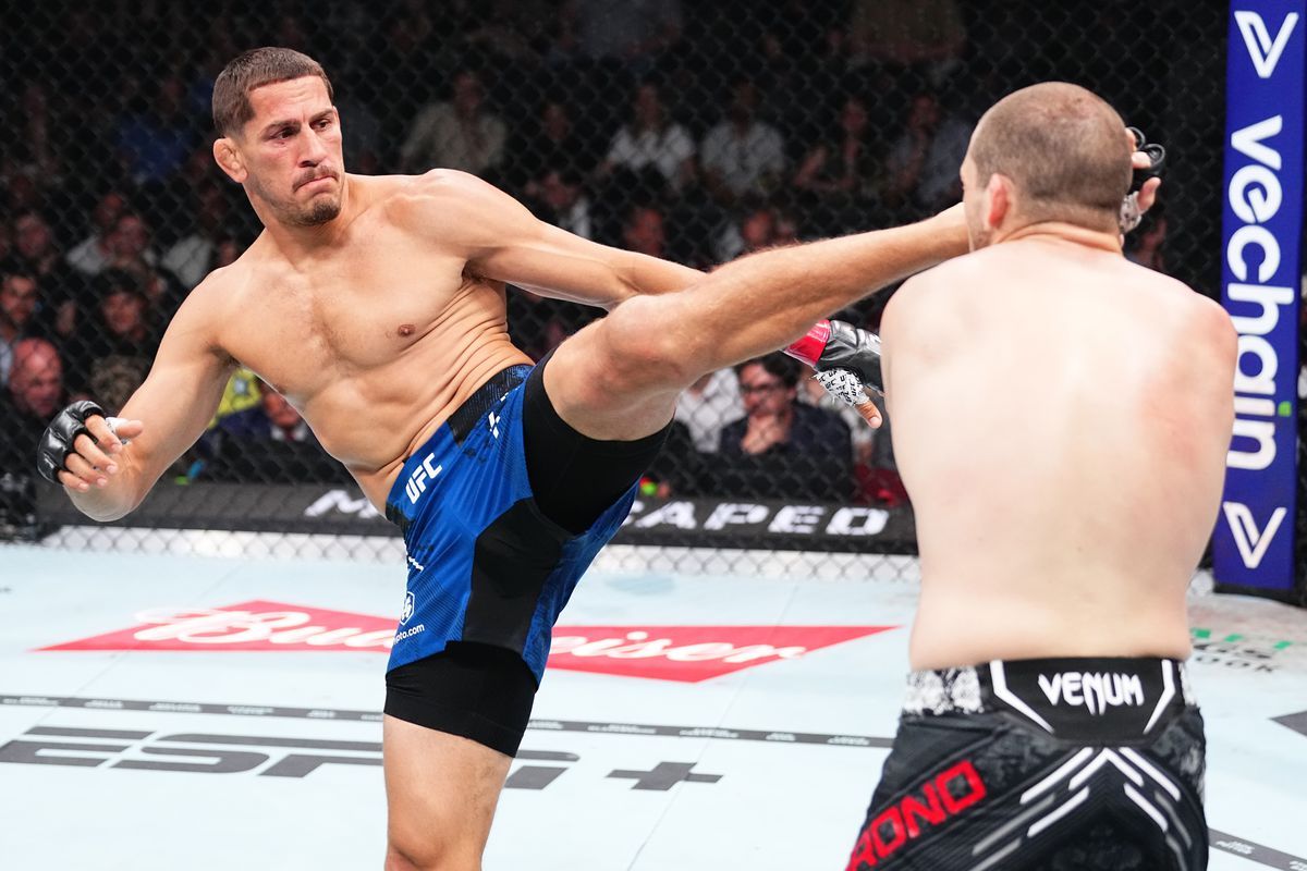 Niko Price launches a head kick at Alex Morono. Credit: MMA Fighting.