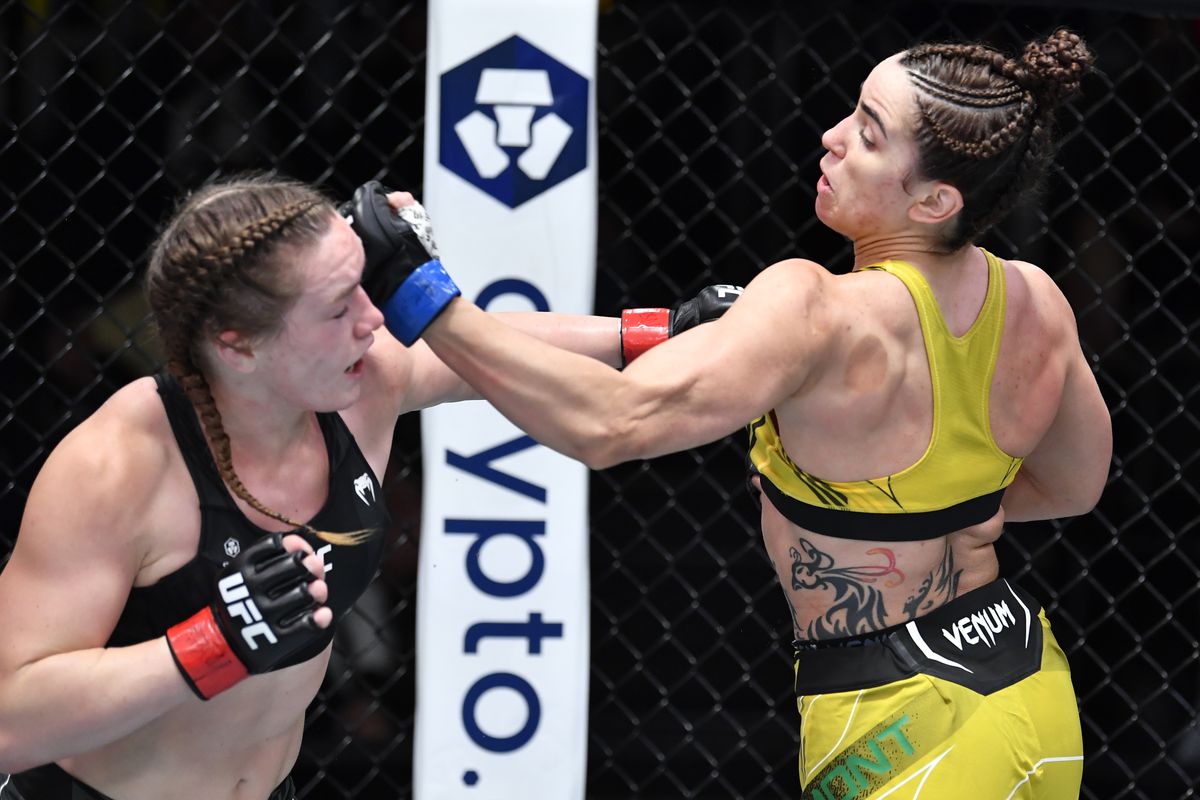Norma Dumont cracks Aspen Ladd with an uppercut. Credit: MMAMania.