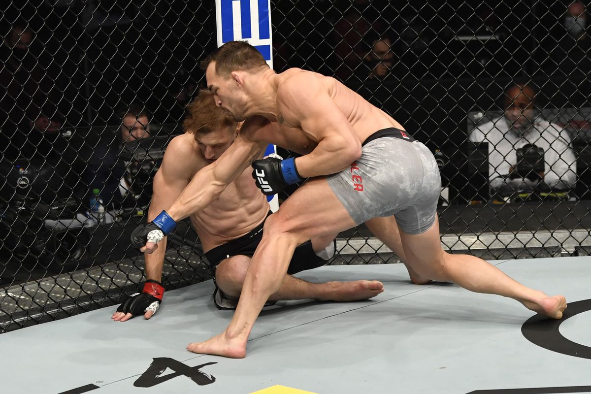 Michael Chandler finishes Dan Hooker off with ground and pound. Credit: MMA Fighting.