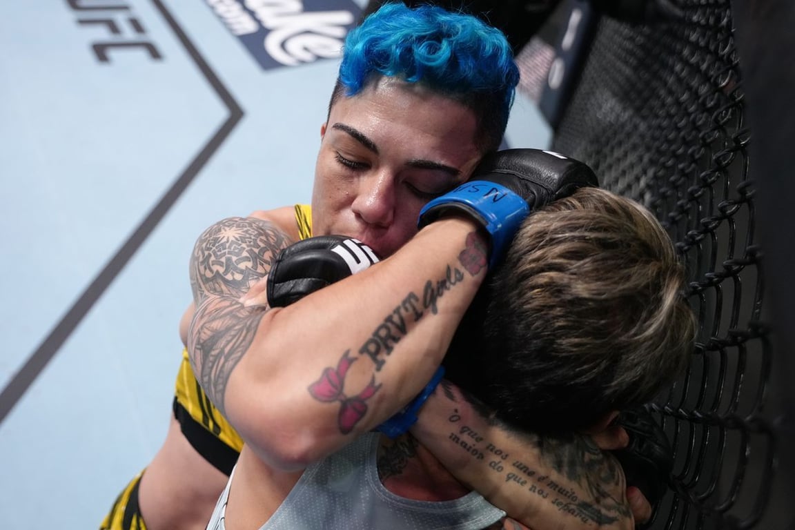 Jessica Andrade locks Amanda Lemos in a standing arm triangle choke. (Jeff Bottari/Getty Images)