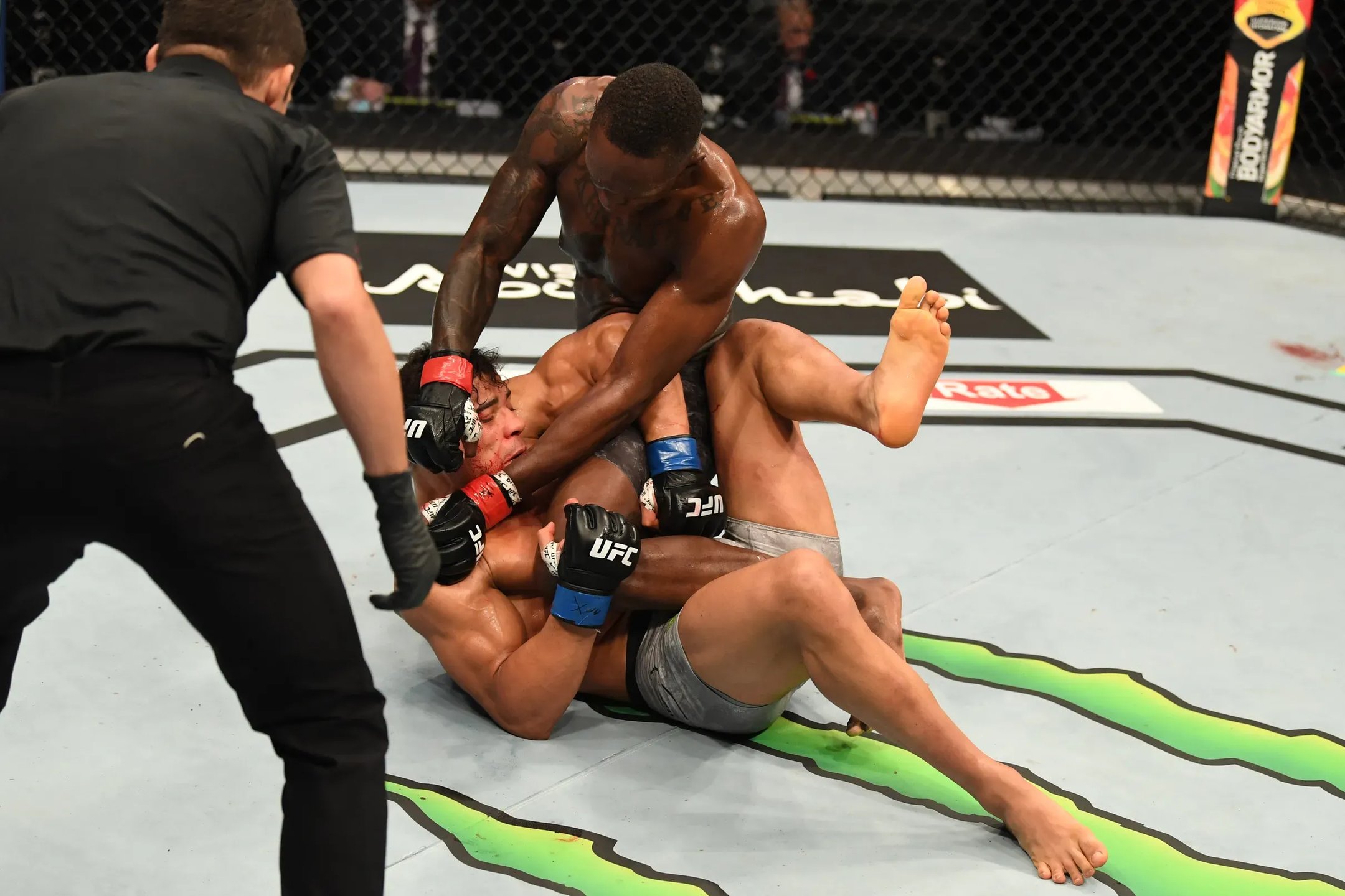 Israel Adesanya puts the final touches on the finish against Paulo Costa. Credit: Josh Hedges/Zuffa LLC