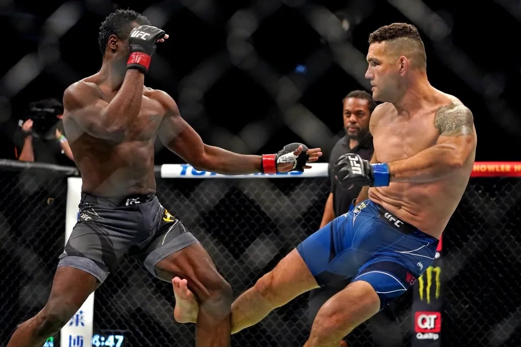 Chris Weidman snapping his leg on Uriah Halls shin at UFC 261. Credits to: Jasen Vinlove - USA TODAY Sports.