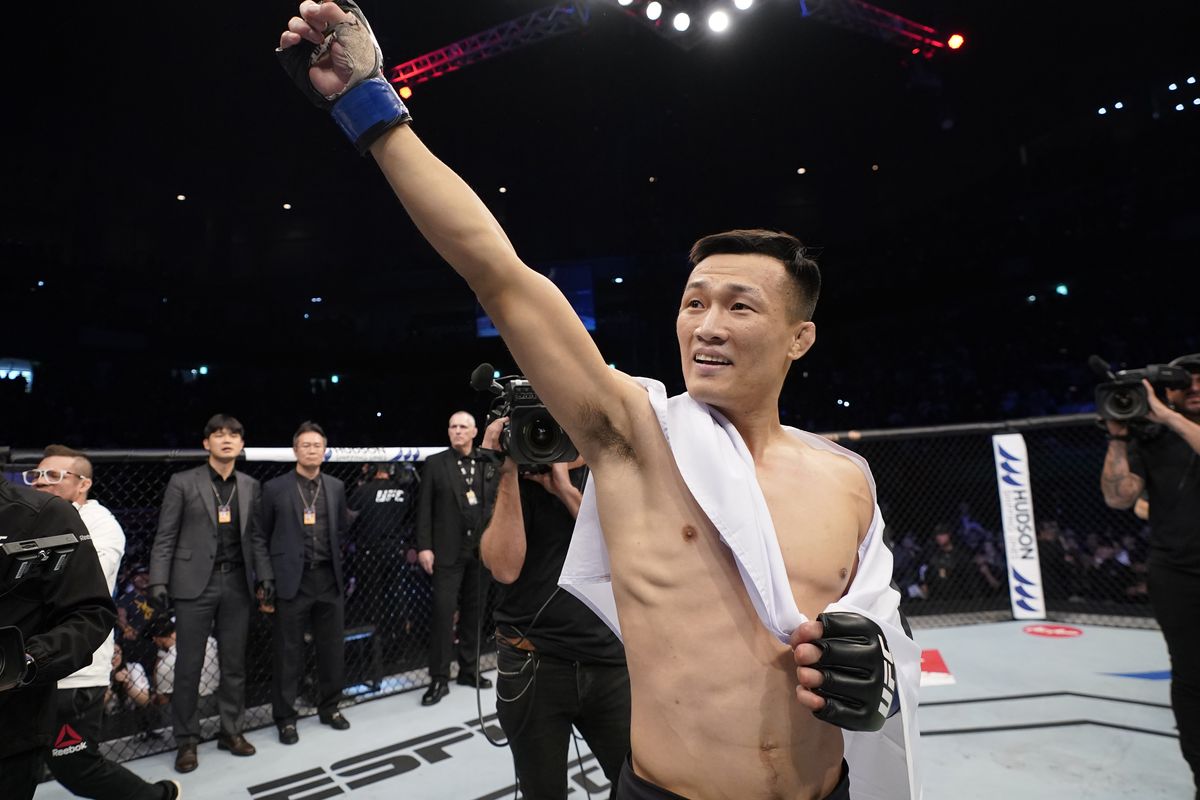 Chan Sung Jung motions to the crowd after a win.  Credits to: Jeff Bottari-Zuffa LLC via Getty Images.