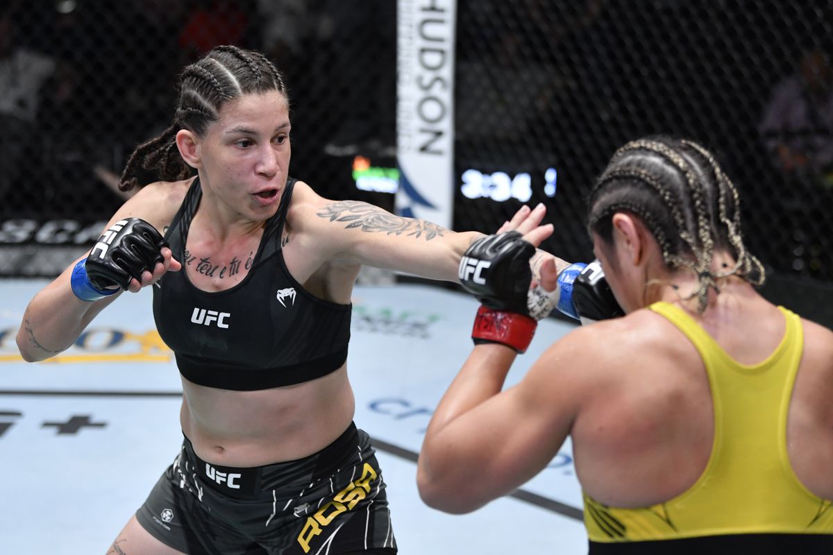 Karol Rosa pops Bethe Correia with a jab. Credit: MMAFighting.