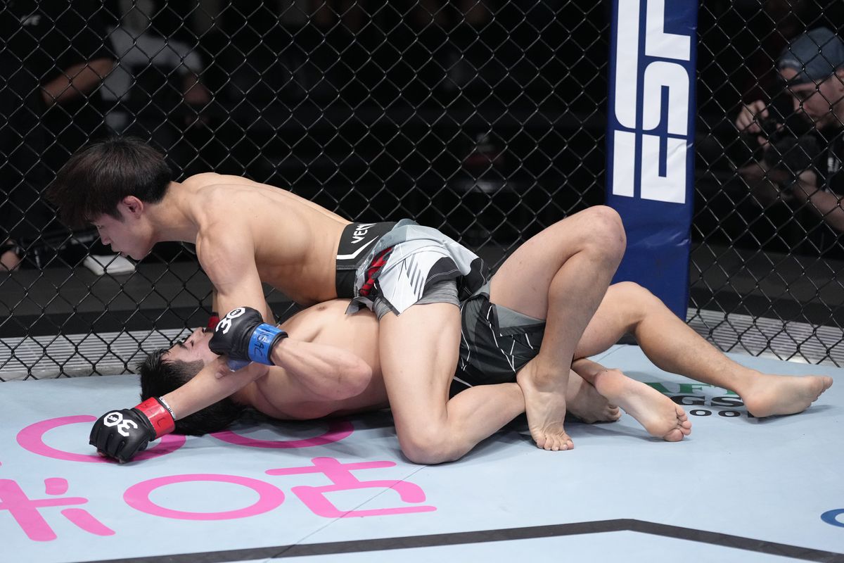 Tatsuro Taira holds full mount on Jesus Aguilar. Credit: MMA Fighting.
