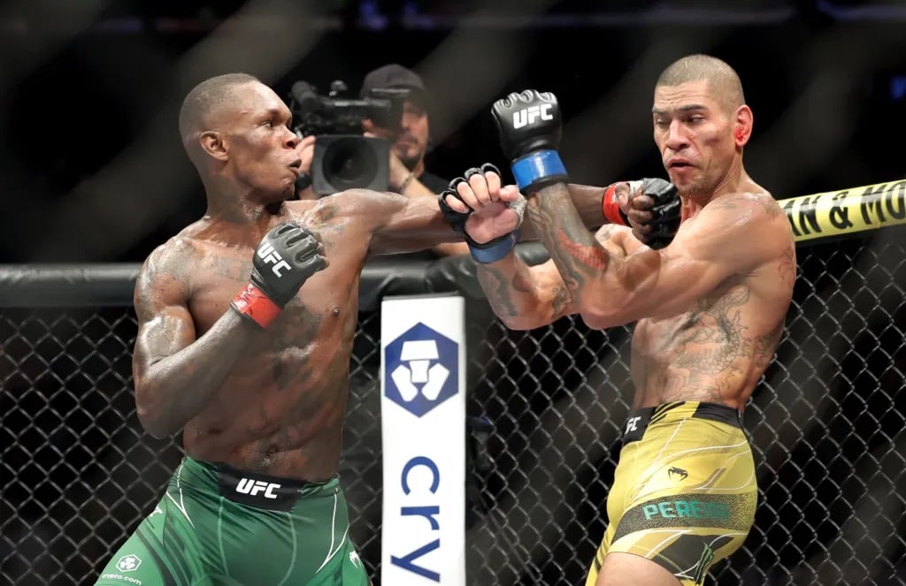 Alex Pereira and Israel Adesanya exchanging at in the main event of UFC 281. Credits to: Jessica Alcheh - USA TODAY Sports.