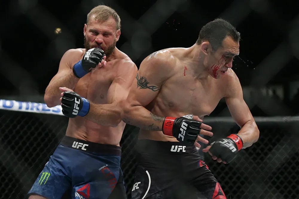 Donald Cowboy Cerrone throwing down with Tony Ferguson in one of his many Fight of the Night bouts. Credits to: Jerry Lai - USA TODAY Sports.