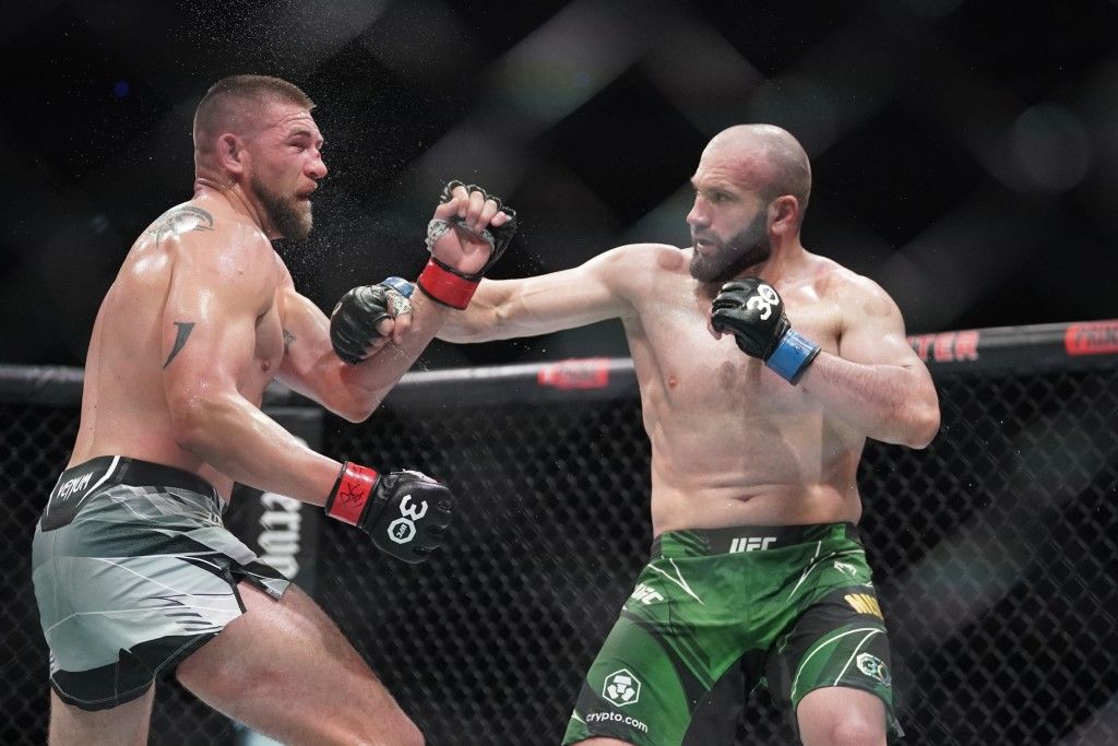 Azamat Murzakanov landing a hook vs. Justin Jacoby. Credits to: Denny Medley - USA TODAY Sports.