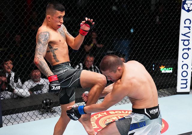 Molina scoring a knee against Zhalgas Zhumagulov. Photo by Chris Unger, Zuffa LLC.