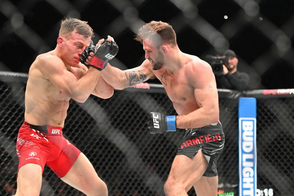 Garrett Armfield cracks Brad Katona with a right hand. Credit: Yahoo Sports.