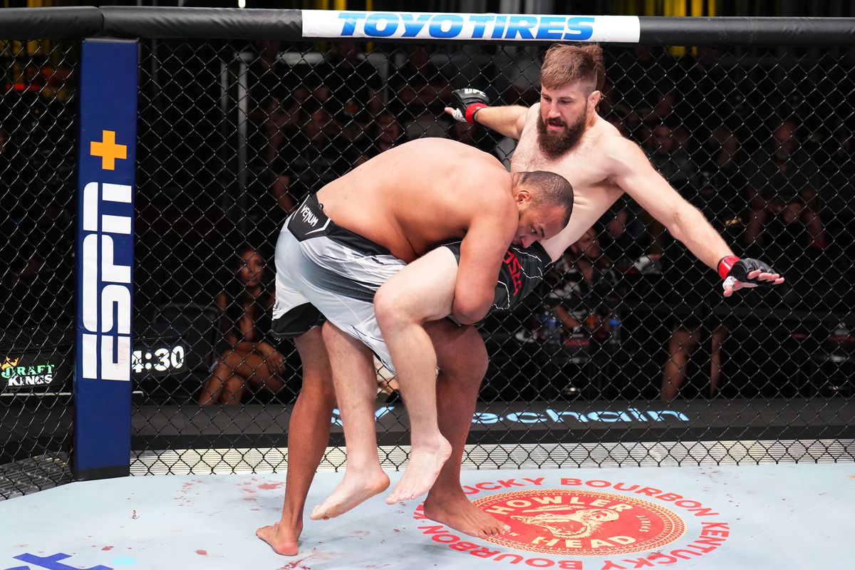 Rodrigo Nascimento takes Tanner Boser off his feet with a takedown. Credit: MMA Fighting.