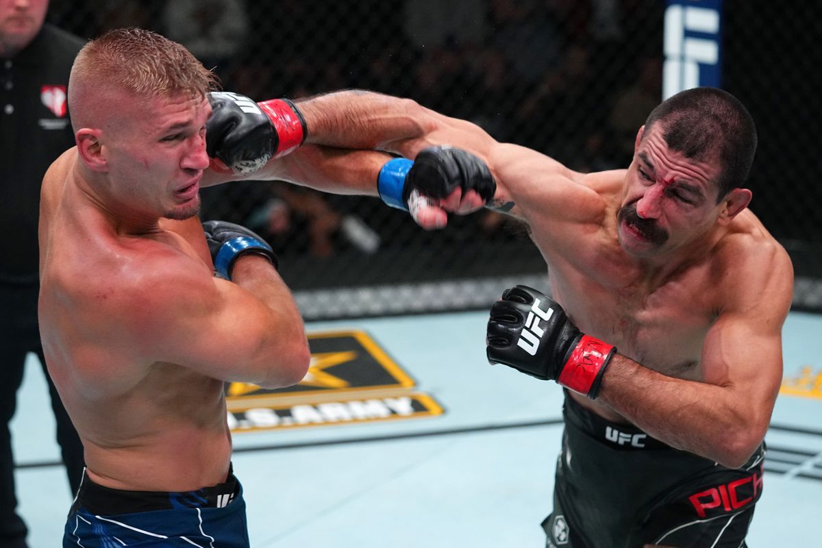 Vinc Pichel lands a right hand on Austin Hubbard. Credit: MMA Fighting.