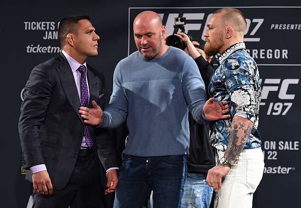 Rafael Dos Anjos and Conor McGregor facing off at UFC 197 press conference. Credits to: Jeff Bottari-Zuffa LLC.